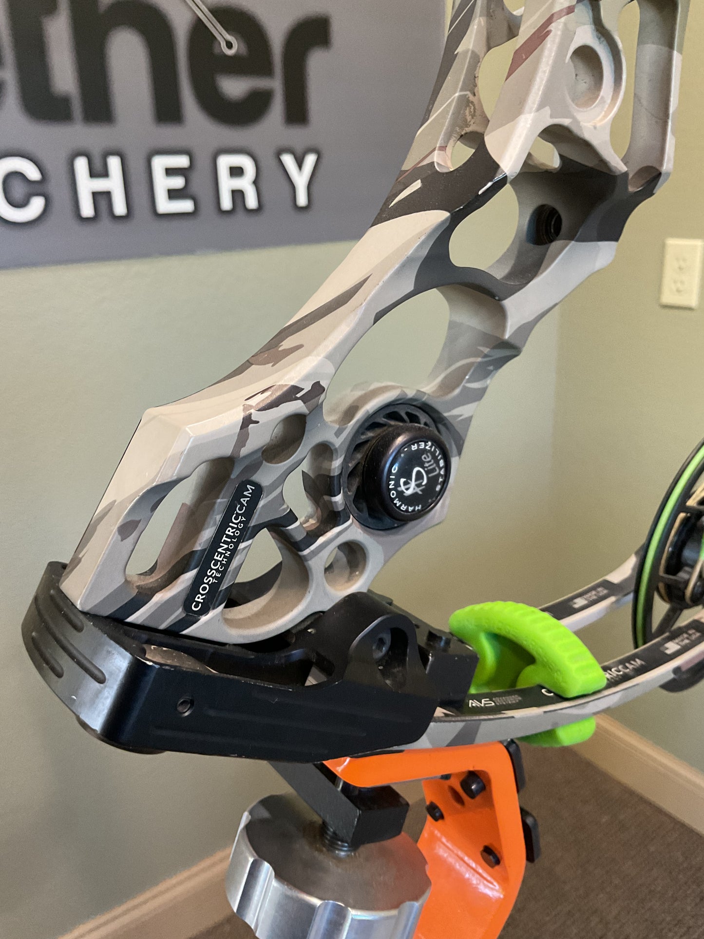 Mathews Archery used compound bow bottom limb set in camo color and green limb dampener.