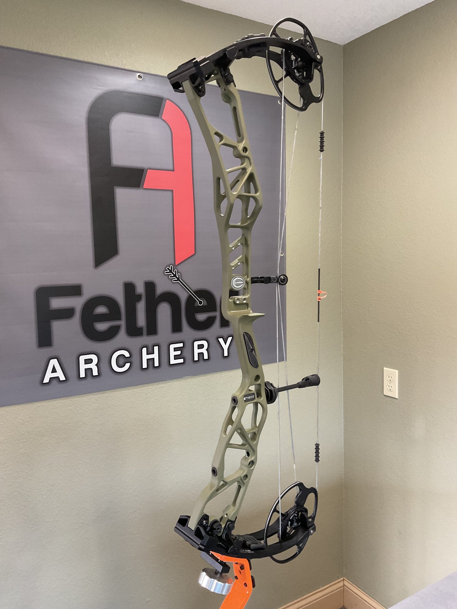 Selection of used compound bows for sale at Fether Archery — Hillsdale, Michigan archery shop