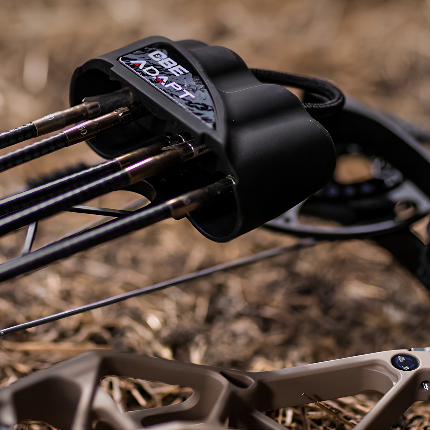 CBE Adapt bow quiver mounted to a bow with broadheads, lifestyle photo with blurred background