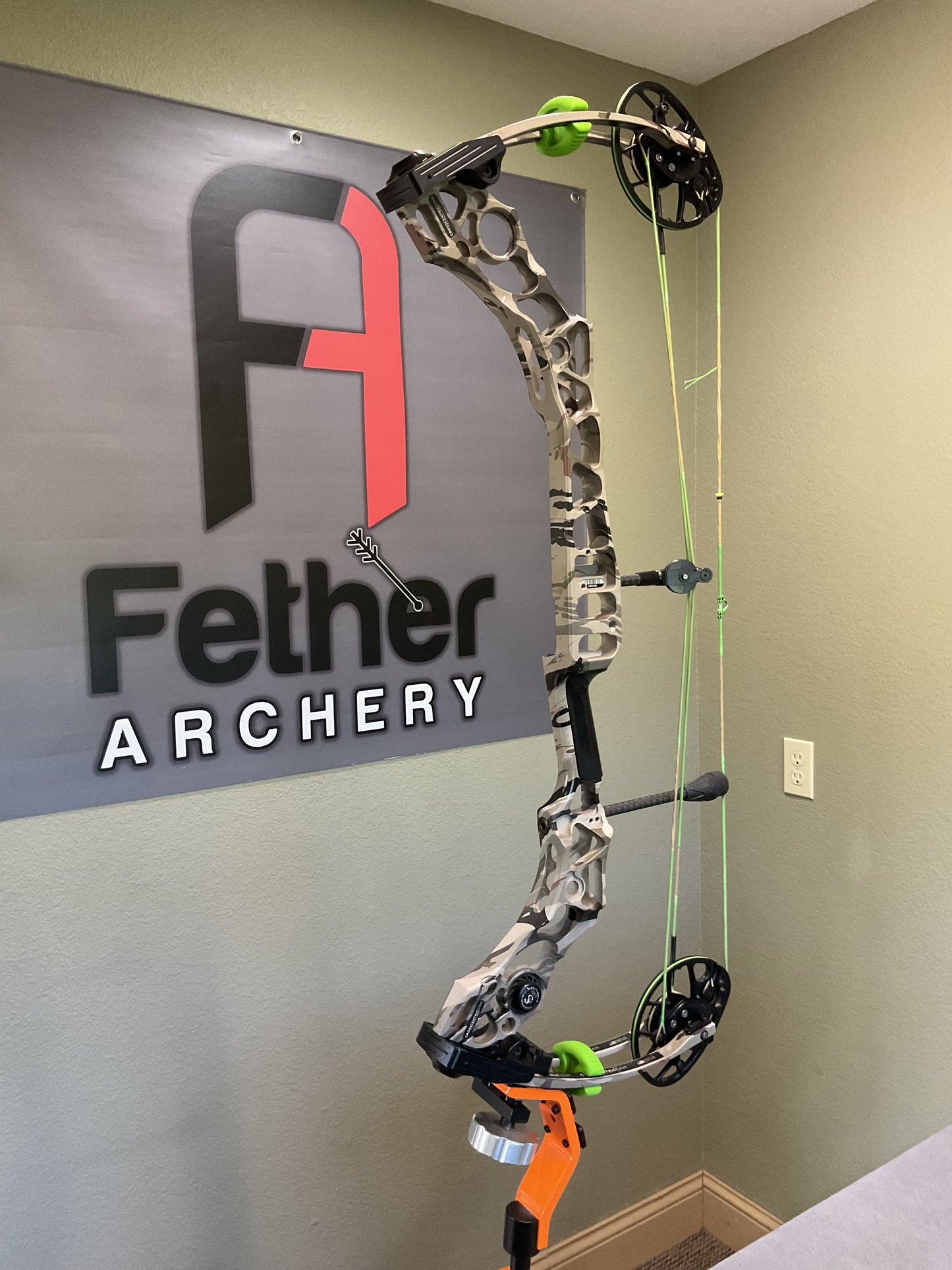 Side view of Used Mathews Bow in camo pattern