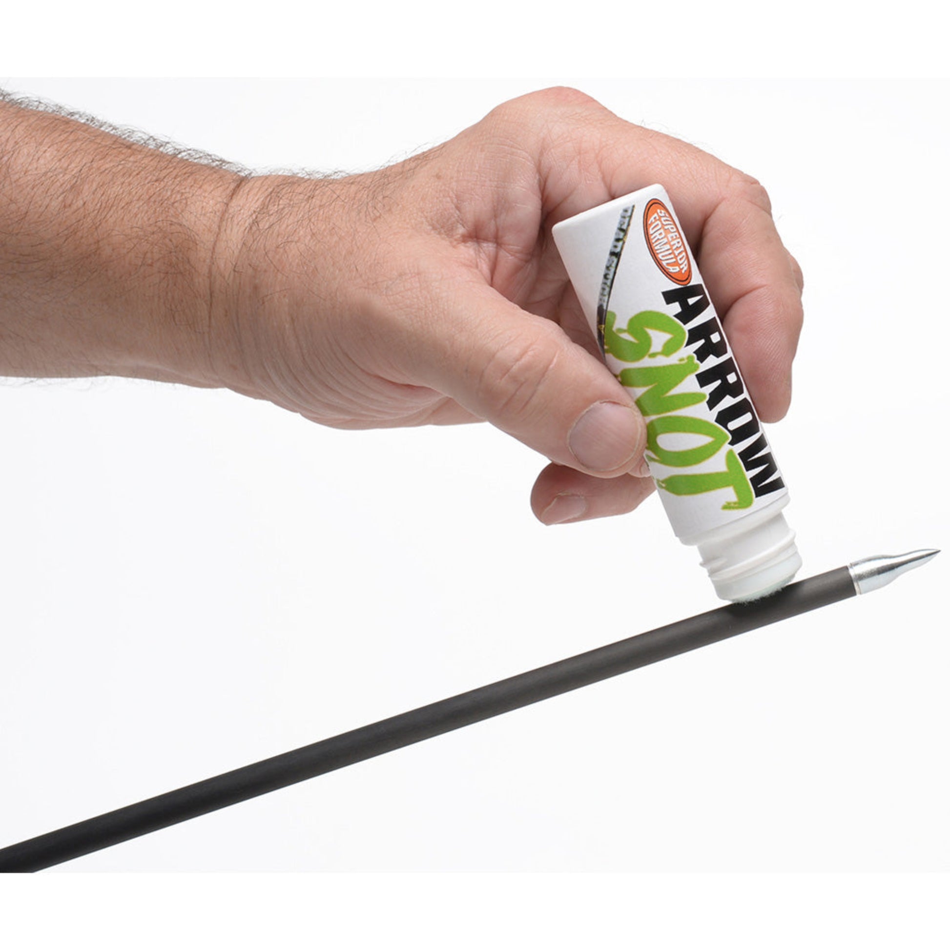 Archer applying 30-06 Arrow Snot arrow release fluid to arrow shaft with felt tip applicator