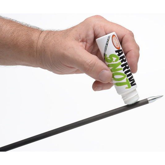 Archer applying 30-06 Arrow Snot arrow release fluid to arrow shaft with felt tip applicator
